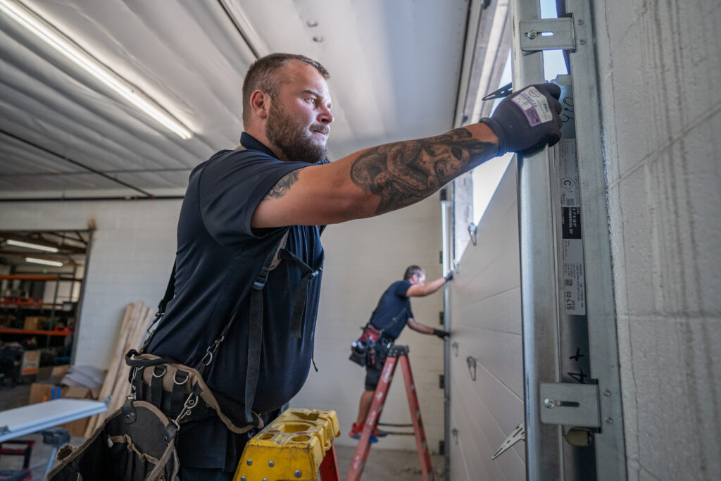 Garage Door Installation 1 Two Technicians Installing a New Garage Door | Quality Garage Door Installation | Cost of a Garage Door Installation